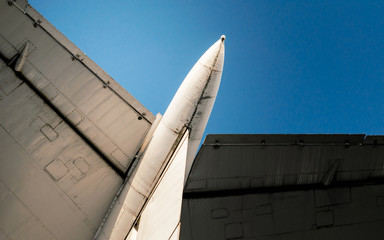 wings of a large soviet airliner against a blue sky