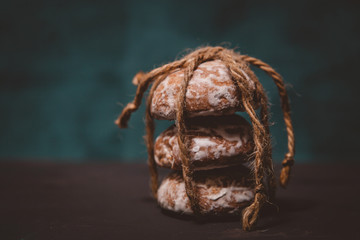 fresh gingerbread cookies tied with a rope on the table