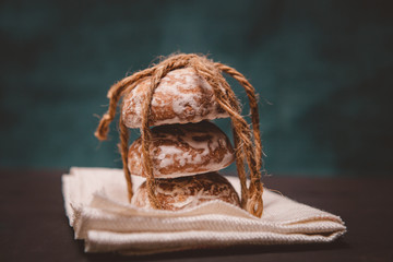 fresh gingerbread cookies tied with a rope on the table