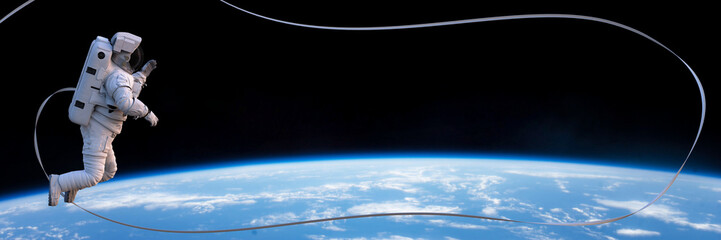 astronaut with safety tether during a spacewalk in orbit of planet Earth space  © dottedyeti