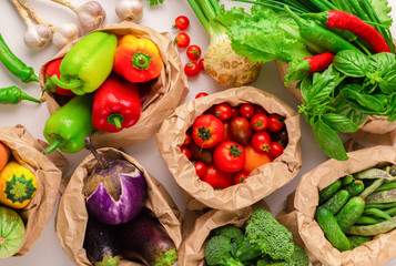 Assorted raw organic vegetables from garden in zero waste packages