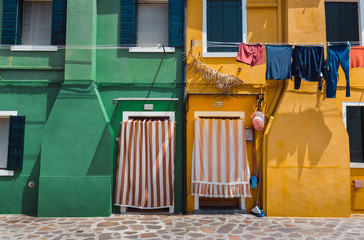 Fototapeta na wymiar Burano Bright colored houses Venice Italy summer destination Europe city