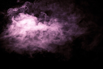 Jet of smoke on black background. Selective focus. Toned