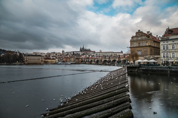 Weir and barrage over wide river in old town