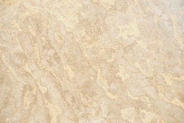 Closeup of beautiful stone texture wall in light warm golden tone for rough surface and modern...