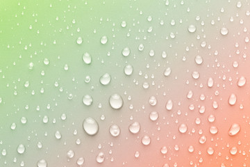 Drops of water on a color background