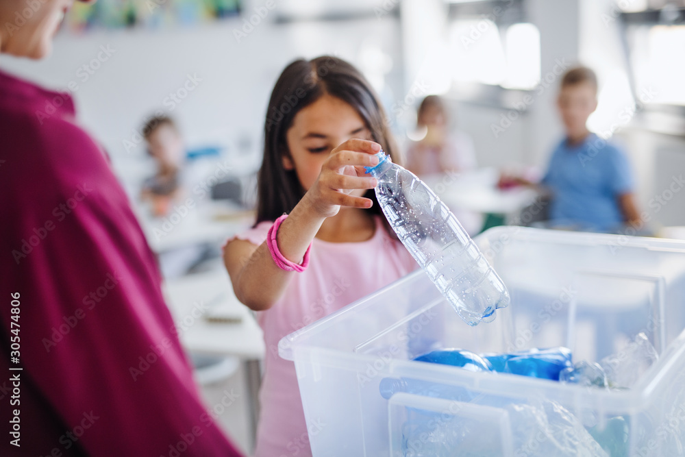 Sticker A teacher with small school kids in classroom learning about waste separation.