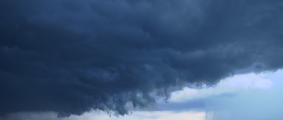Panoramic photo of the sky. Late summer evening, dense cumulus clouds, pre-storm condition. 