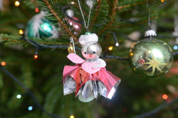 Vintage christmas decoration - small baby angel on a christmas tree