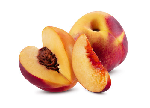 Whole nectarine, one unpitted slice and one cutted part with kernel isolated on white background with copy space for text or images. Close-up.