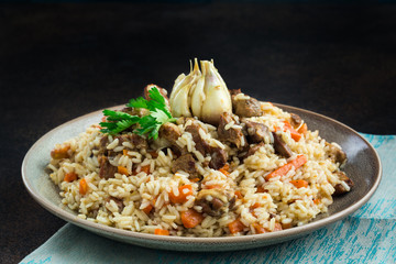 Uzbekistan  national dish - plov, made from: uzbek Devzira rice, lamb, onion, carrot, spiced with cumin, coriander, barberries, red pepper, prepared with head of garlic.