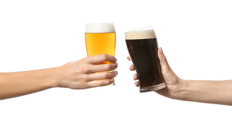 Hands clinking glasses of beer on white background