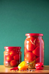 Preserved and fermented food in glass jars. Fermented food. Autumn canning. Сucumber, squash and tomatoes pickling and canning into glass jars.