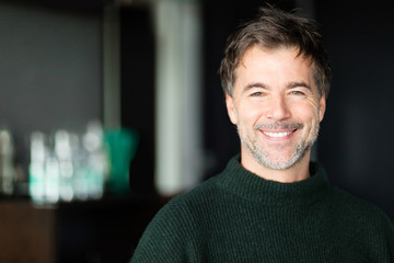  Handsome senior man smiling. At the hotel. Nice smile.