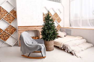 Interior of modern bedroom with Christmas tree