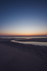 Fototapeta na wymiar Sonnenuntergang am Strand beim Roten Kliff auf der Insel Sylt