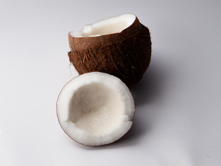 Two halves of coconut isolated on white background