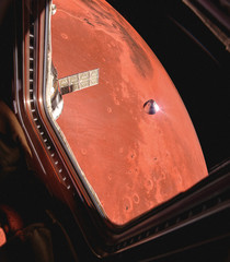 Fictional image of planet Mars and an orbiter capsule seen through a window of a space station....