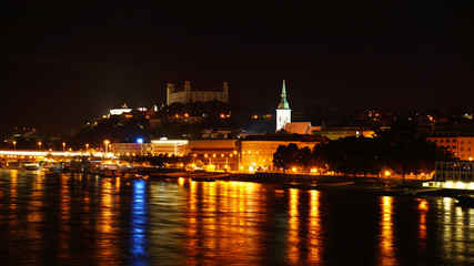 Fototapeta na wymiar Night over Bratislava. Night Danube in Bratislava overlooking the Bratislava Castle.
