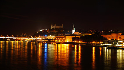 Fototapeta na wymiar Night over Bratislava. Night Danube in Bratislava overlooking the Bratislava Castle.