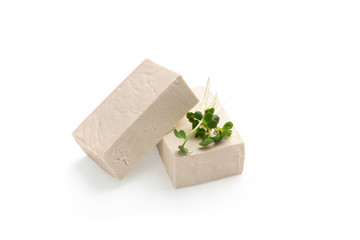 Blocks of Tofu cheese with microgreen leaves