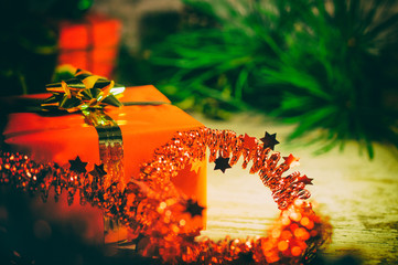 Christmas in the Soviet Union or Russia, with analog effect in retro style. Gifts or packages on an old oak table in the background with green pine needles.