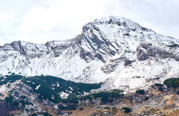Montenegro snow landscape, Durmitor. Layers of mountains and clouds. Montenegro national park Durmitor. Cloudy landscape. Nature autumn view
