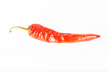 Bright red hot chili pepper isolated on white background