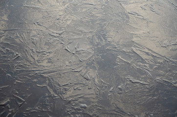 texture of ice on a surface of lake