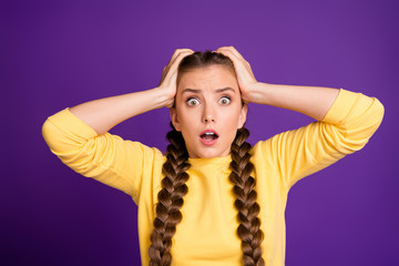 Closeup photo of pretty lady long braids holding arms on head listen awful news discounts period is over wear casual yellow jumper isolated purple color background