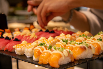  maki sushi roll on black plate
