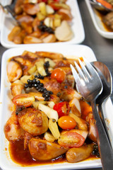  mixed sausage with tomato sauce in plate