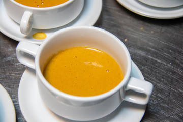  pumpkin soup in white cup gourmet