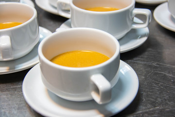  pumpkin soup in white cup gourmet