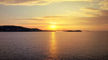 Aerial drone photo of beautiful sunset as seen from main village of Mykonos island, Cyclades, Greece