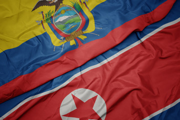 waving colorful flag of north korea and national flag of ecuador.