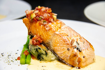  salmon steak with sauce on plate
