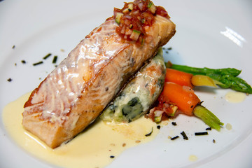 salmon steak with sauce on plate