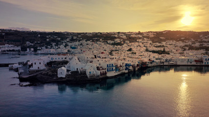 Aerial drone panoramic photo of picturesque old port in main village of Mykonos island at sunrise with beautiful colours, Cyclades, Greece