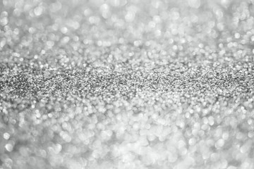 Abstract blur silver glitter sparkle defocused bokeh light background