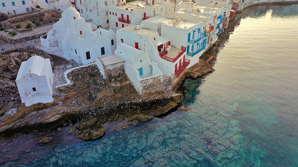 Fototapeta na wymiar Aerial drone panoramic photo of picturesque old port in main village of Mykonos island at sunrise with beautiful colours, Cyclades, Greece