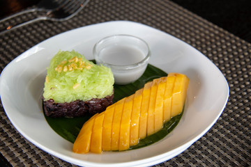  mango  sticky rice on white plate