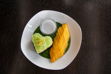  mango  sticky rice on white plate