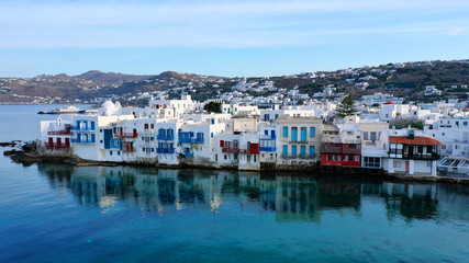 Fototapeta na wymiar Aerial panoramic view of world famous whitewashed little Venice picturesque settlement in main village of Mykonos island with beautiful deep blue sky and clouds, Cyclades, Greece