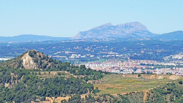 Mountain landscape in Catalonia overlooking the mountains and the small town of Sabadell
