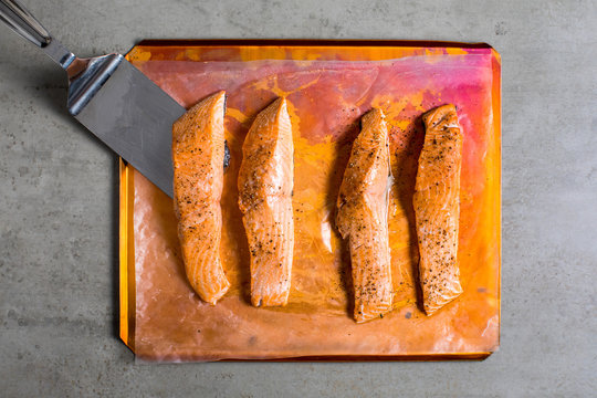Row of baked salmon filets