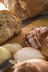 traditional fresh bread with slices od bacon with onion served on wooden plate, european national snack, slovak food 