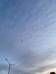 sky with plane and street light