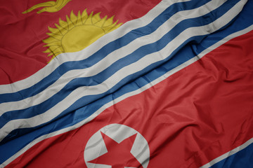 Fototapeta na wymiar waving colorful flag of north korea and national flag of Kiribati .