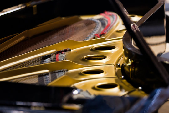  Piano strings closeup in dark colors 